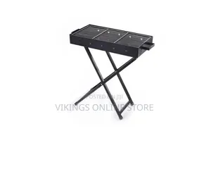 A Portable Folding Charcoal BBQ Grill With a Black Rectangular