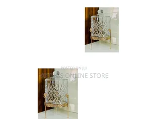 Crystal-Cut Glass Beverage Dispenser With a Decorative Gold Metal