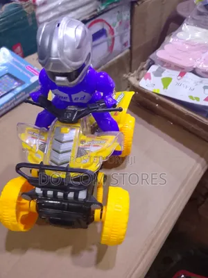 Battery-Powered Toy Quad Bike With a Rider