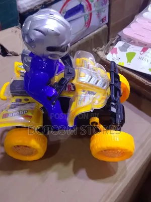 Battery-Powered Toy Quad Bike With a Rider