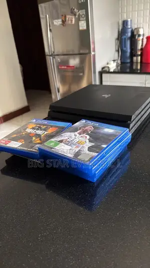 PS4 Slim With 2 Pads and 10 Games