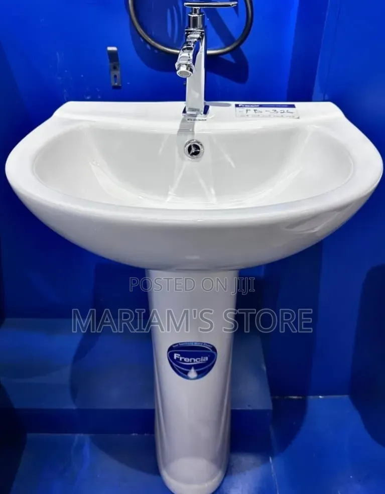 Ceramic Pedestal Wash Hand Basin Complete With a Chrome Faucet.