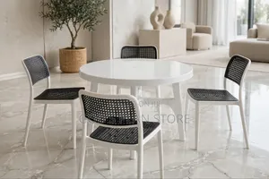 Round Plastic Table and Black Woven Plastic Chairs Comb