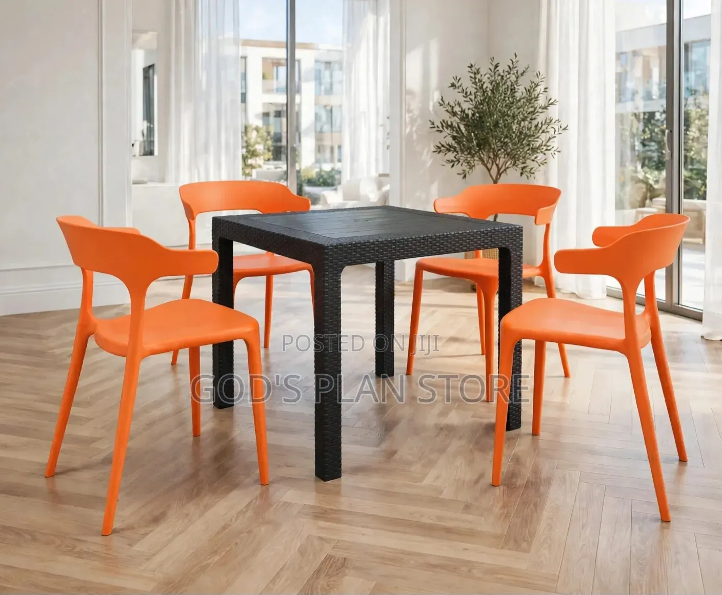 Black Rattan Plastic Table and Orange Plastic Chairs