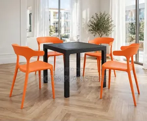 Black Rattan Plastic Table and Orange Plastic Chairs