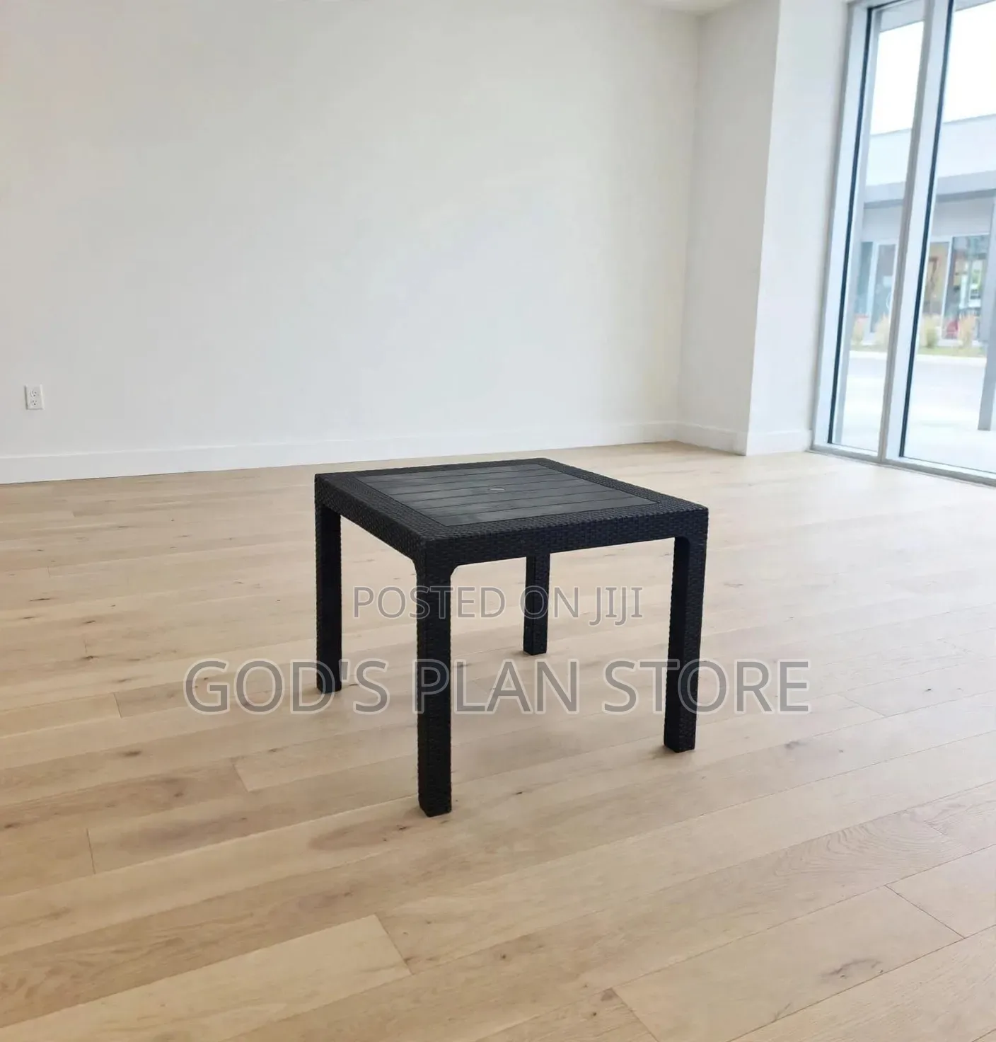 Black Rattan Plastic Table and Orange Plastic Chairs