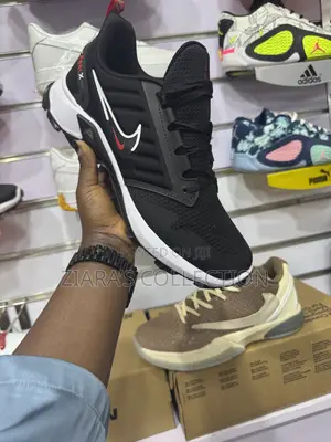 Black and White Nike Fast X Sneakers