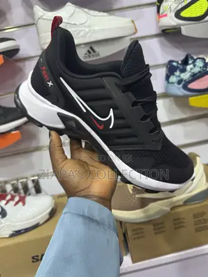 Black and White Nike Fast X Sneakers