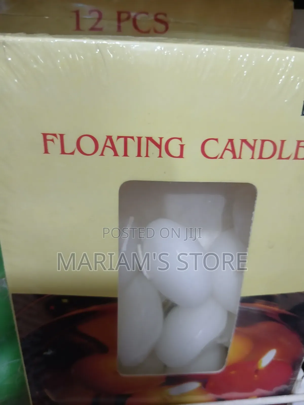 Box of White, Oval-Shaped Floating Wax Candles.