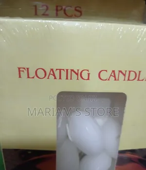 Box of White, Oval-Shaped Floating Wax Candles.