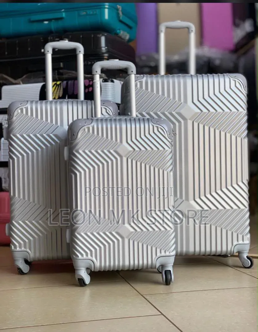 Silver Patterned Suit Cases