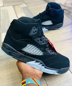 The of Nike Air Jordan 5 Retro Sneakers in the Black. Man