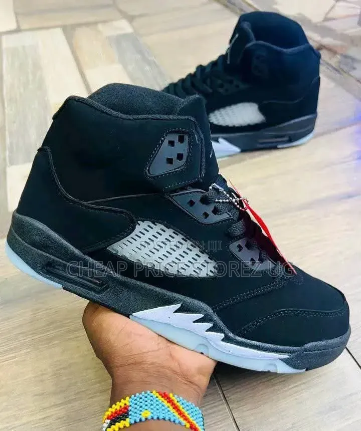 The of Nike Air Jordan 5 Retro Sneakers in the Black. Man