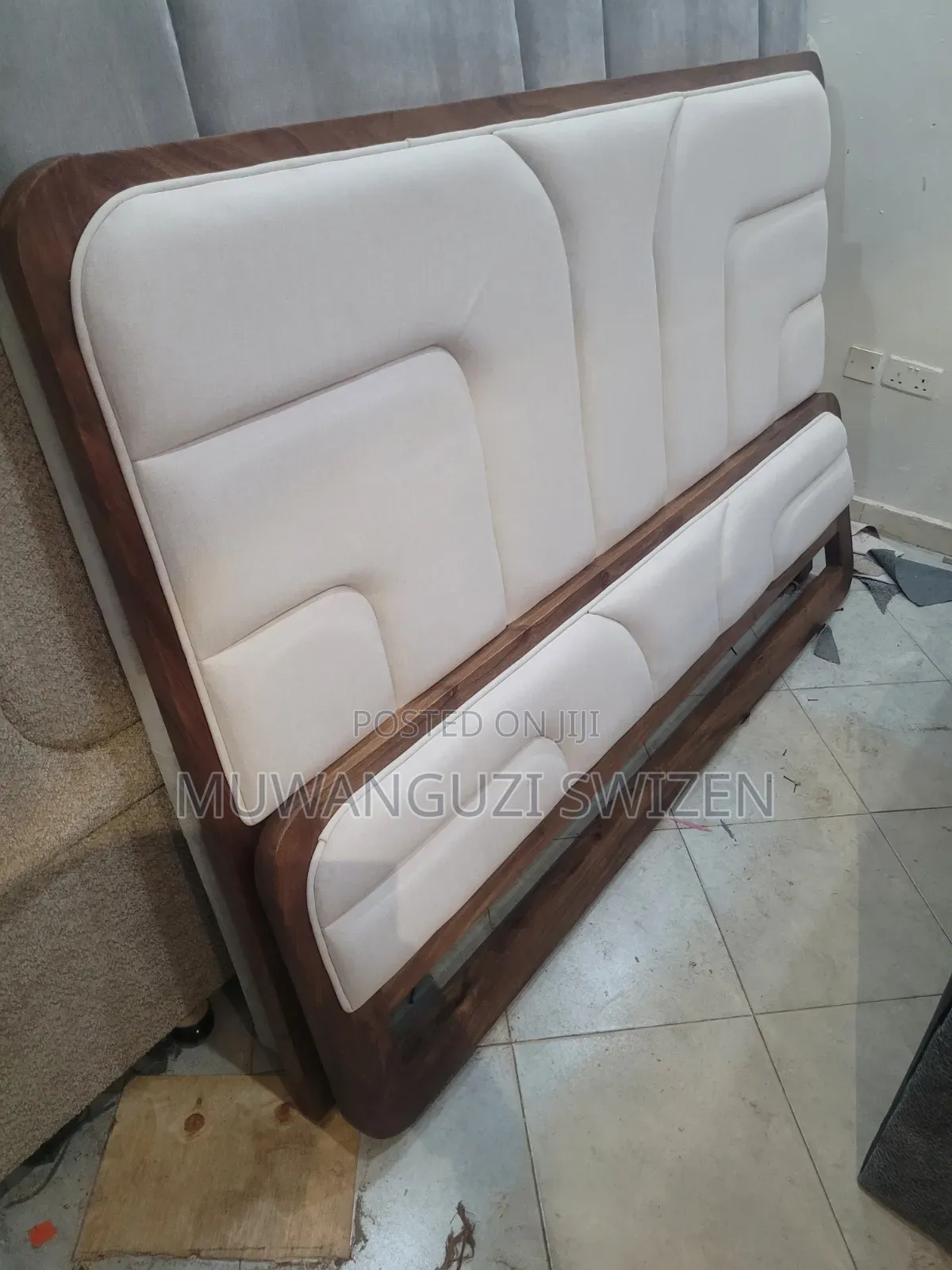 It's a Six by Six (6×6) Wooden and Fabric Bed