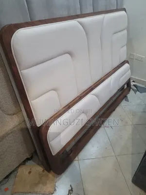 It's a Six by Six (6×6) Wooden and Fabric Bed