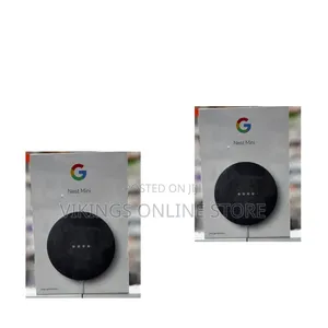 Mini (2nd Generation) Smart Speaker in a Dark Grey/Charcoal Color.