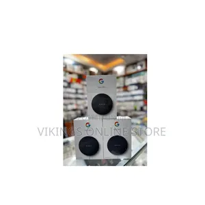Mini (2nd Generation) Smart Speaker in a Dark Grey/Charcoal Color.