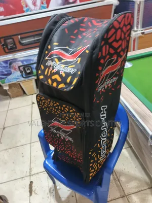 A Black, Red, Orange, Hi Touch Stand-Up Spots Dufle /Kit Bag