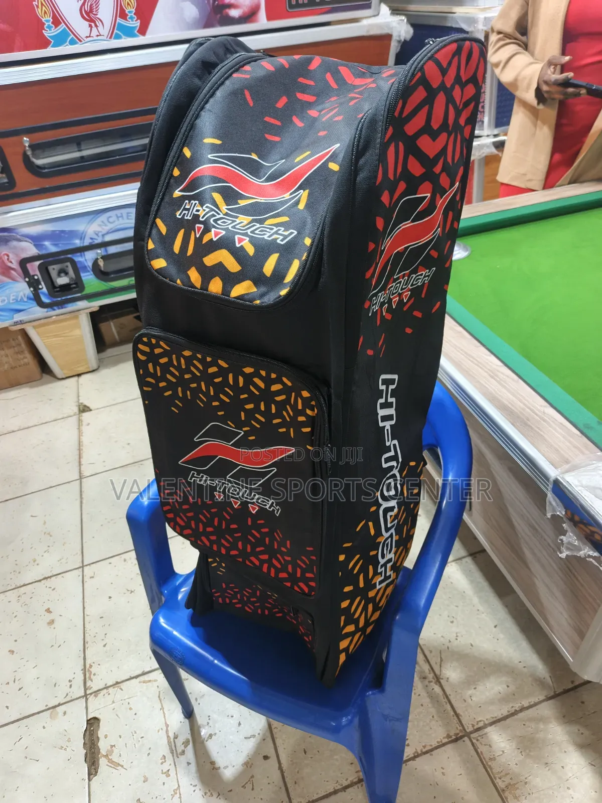 A Black, Red, Orange, Hi Touch Stand-Up Spots Dufle /Kit Bag