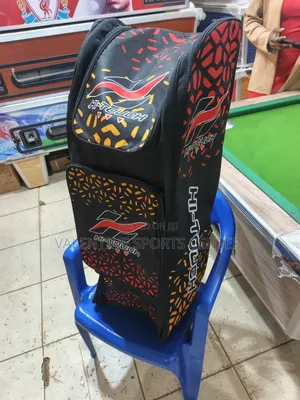 A Black, Red, Orange, Hi Touch Stand-Up Spots Dufle /Kit Bag