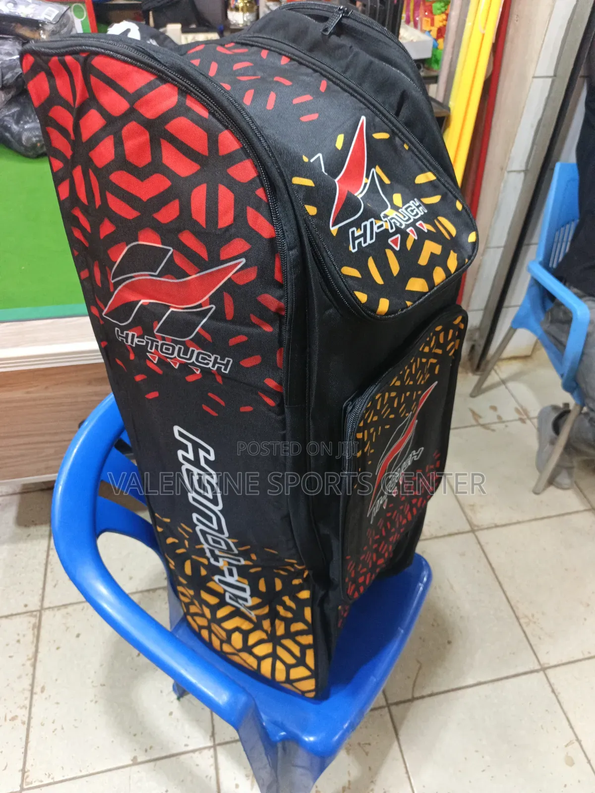 A Black, Red, Orange, Hi Touch Stand-Up Spots Dufle /Kit Bag
