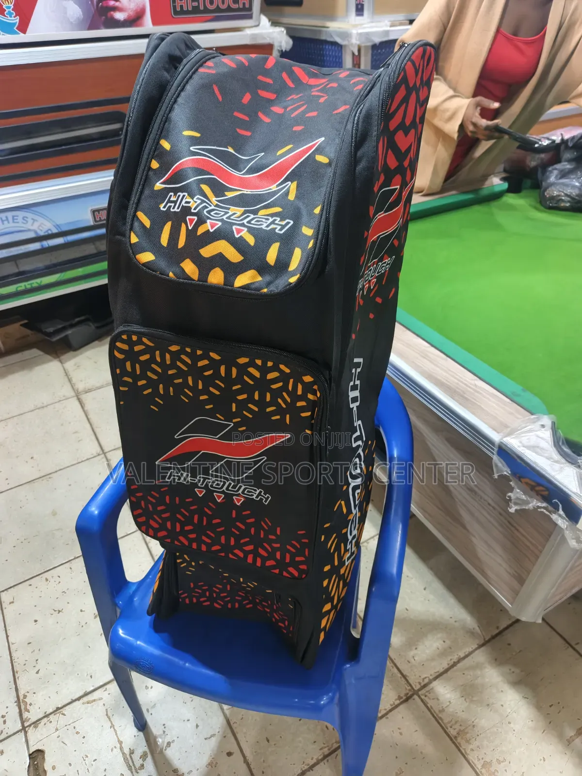 A Black, Red, Orange, Hi Touch Stand-Up Spots Dufle /Kit Bag