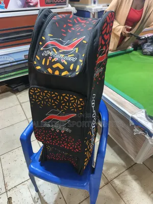 A Black, Red, Orange, Hi Touch Stand-Up Spots Dufle /Kit Bag