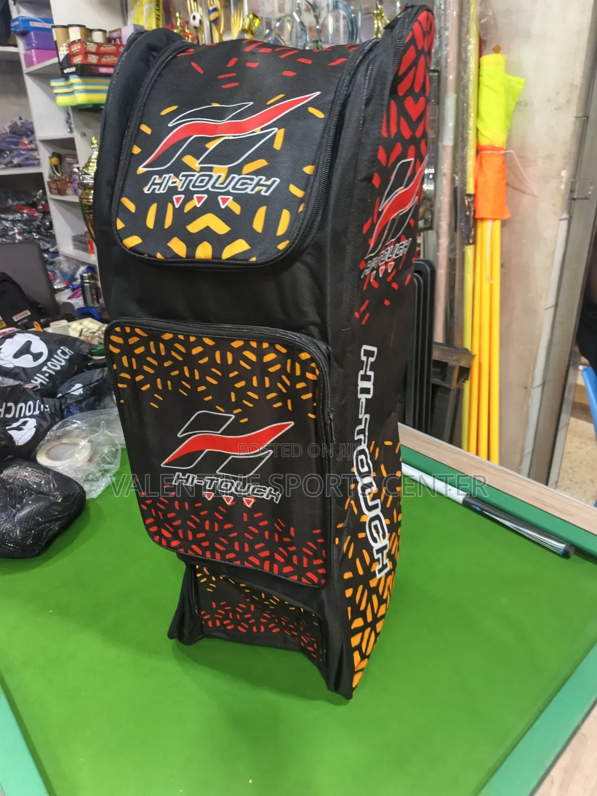A Black, Red, Orange, Hi Touch Stand-Up Spots Dufle /Kit Bag