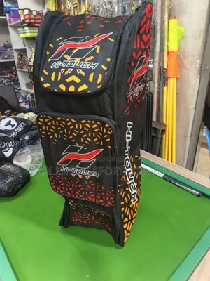 A Black, Red, Orange, Hi Touch Stand-Up Spots Dufle /Kit Bag