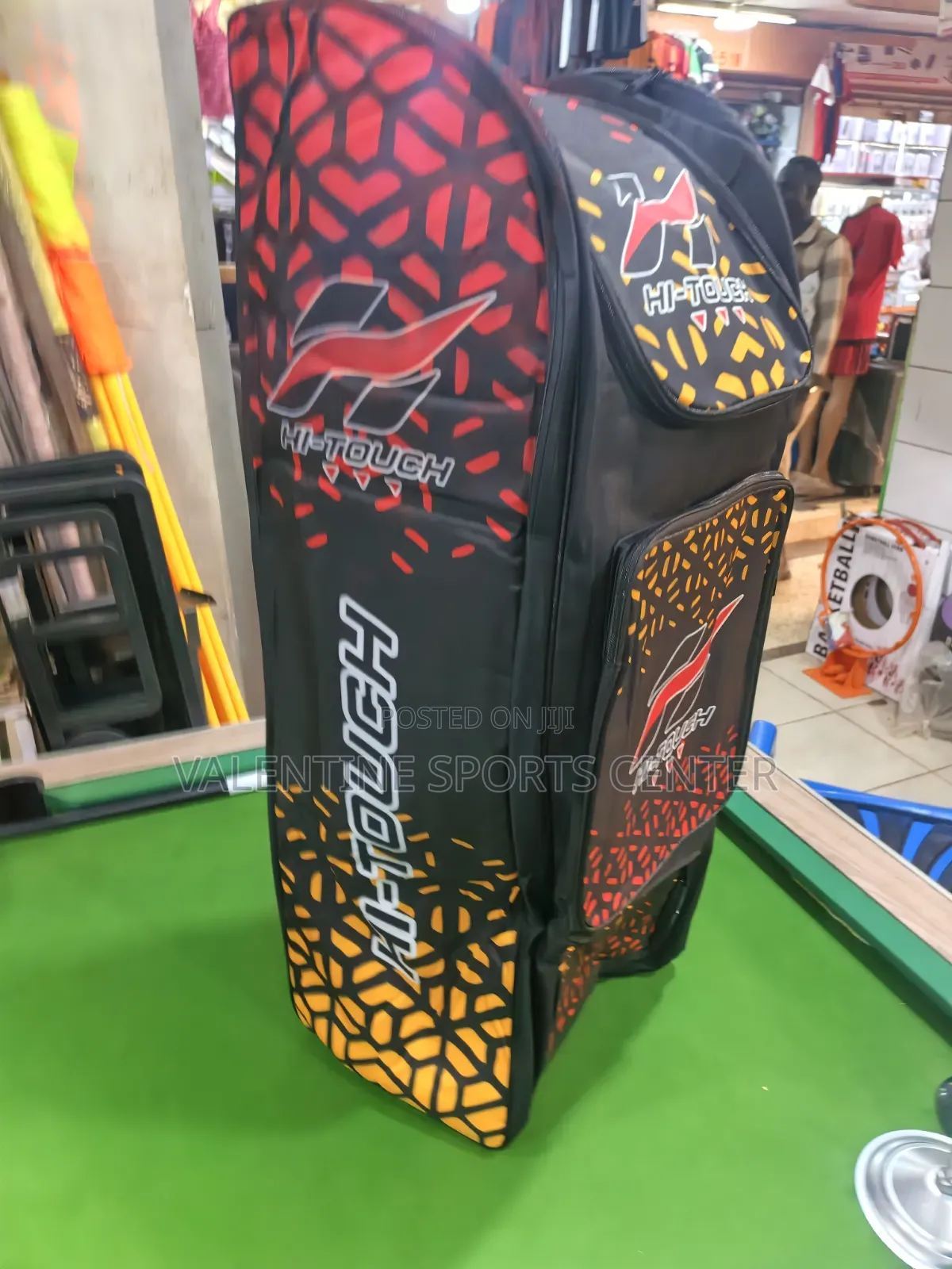 A Black, Red, Orange, Hi Touch Stand-Up Spots Dufle /Kit Bag
