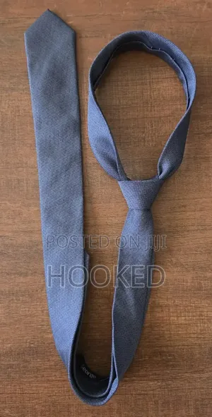 Plain Gray Tie but With Character for a Classic Look.