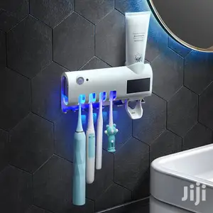 Toothpaste Dispenser Brush Holder And Disinfector
