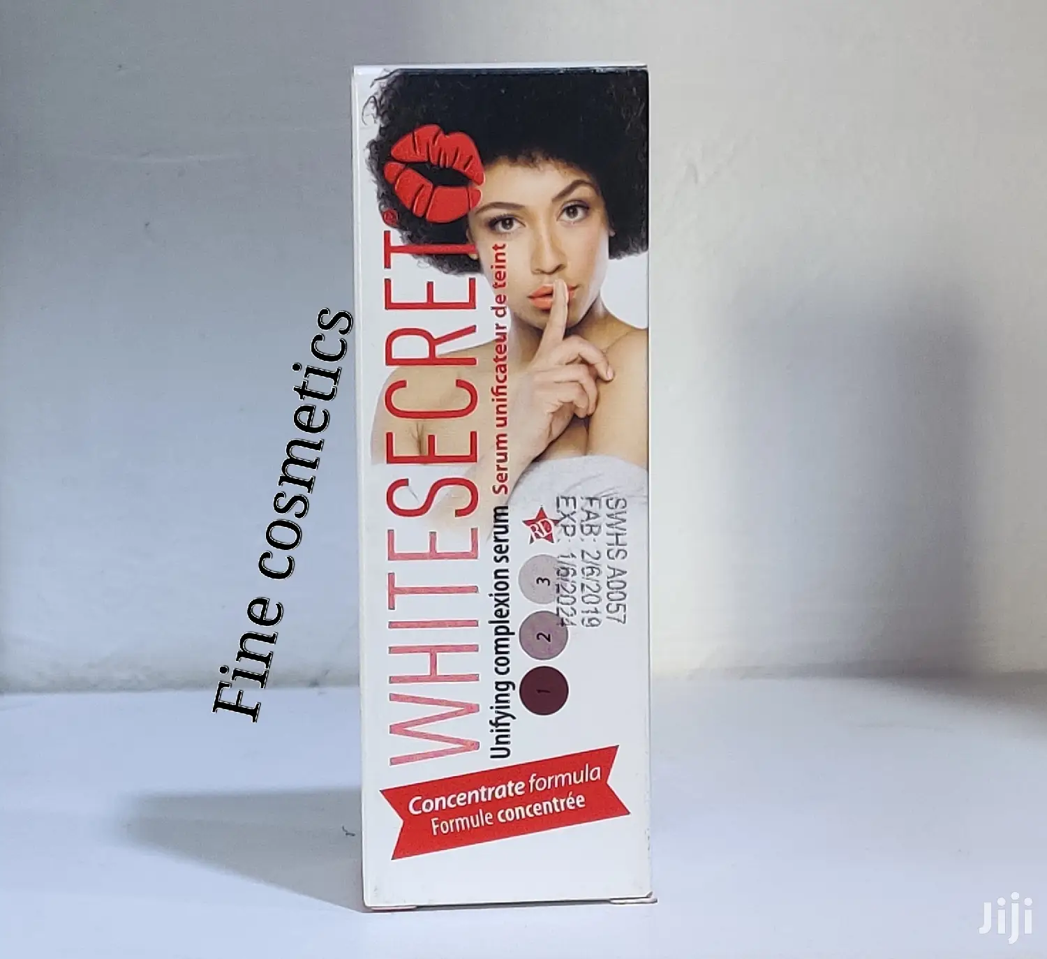 White Secret Lightening Unifying Complexion Vitamin E Serum.