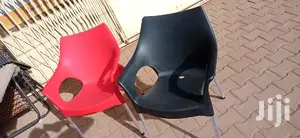 Brand New Plastic Chairs With Metal Stands