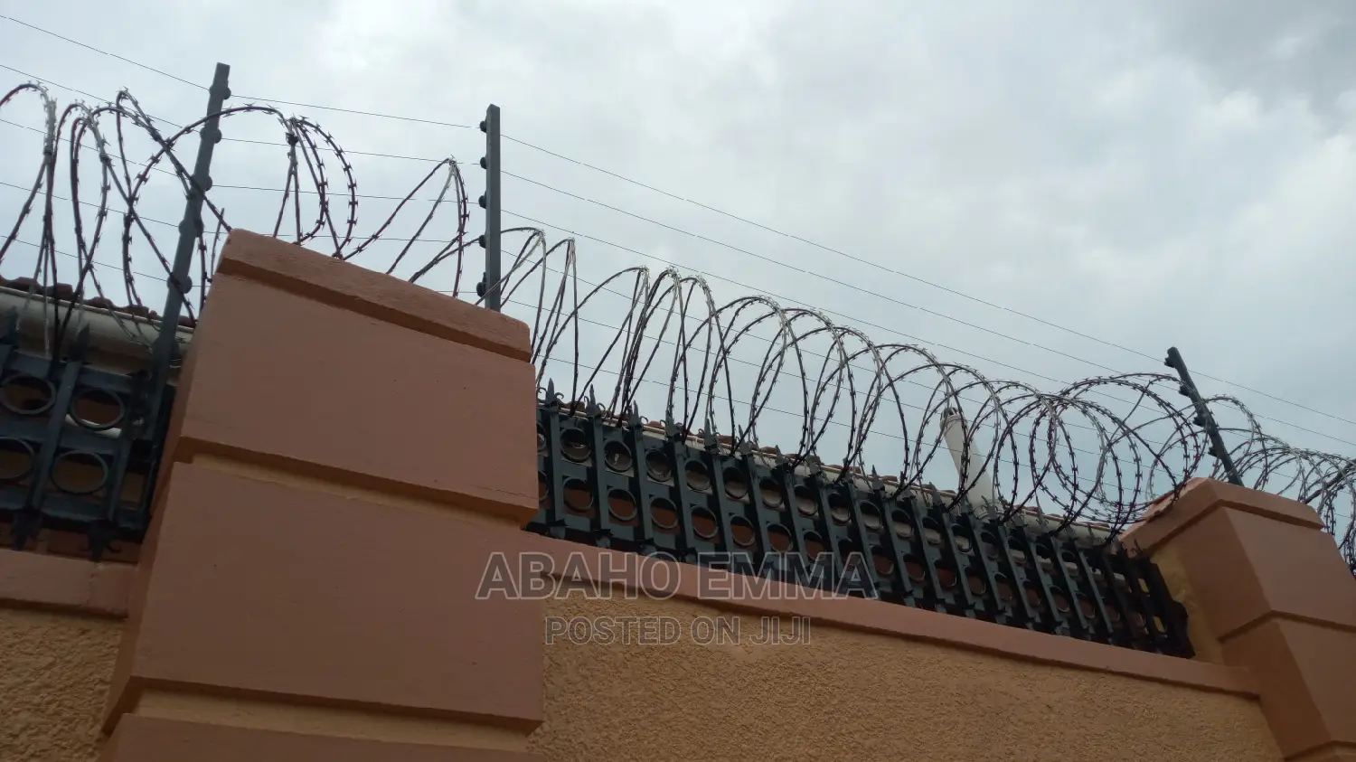 Electrified Razor Wire in Central Division Building Materials, Abaho