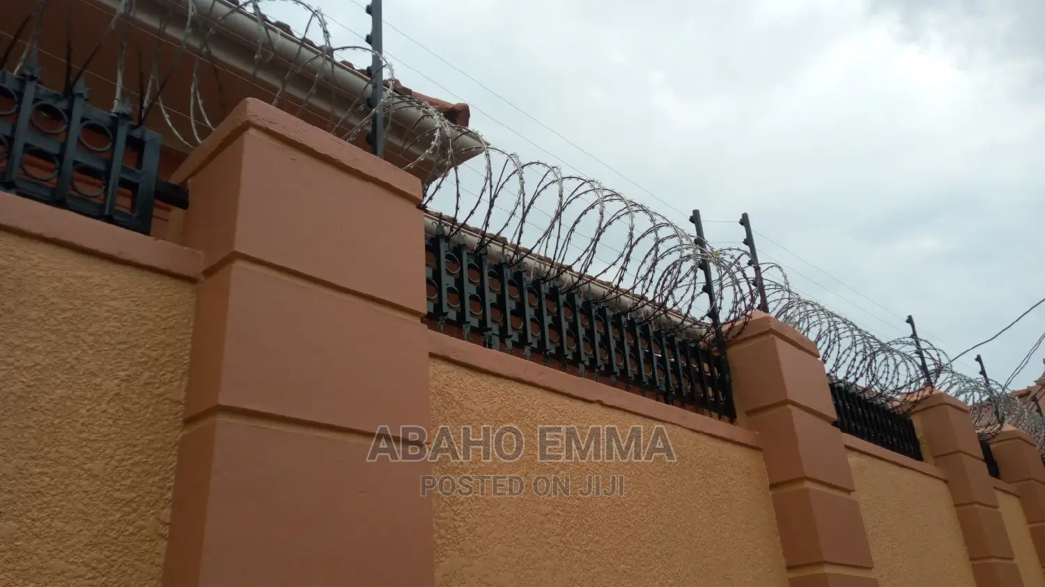 Electrified Razor Wire in Central Division Building Materials, Abaho