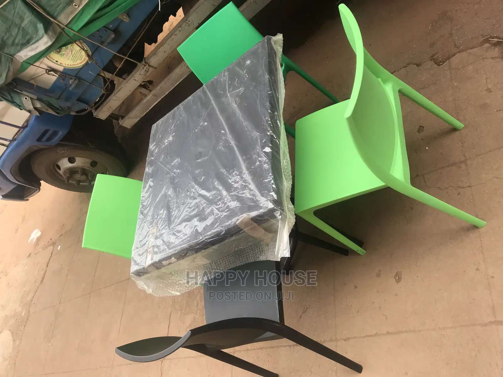 A Set of Strong Imported Table and 4 Plastic Chairs
