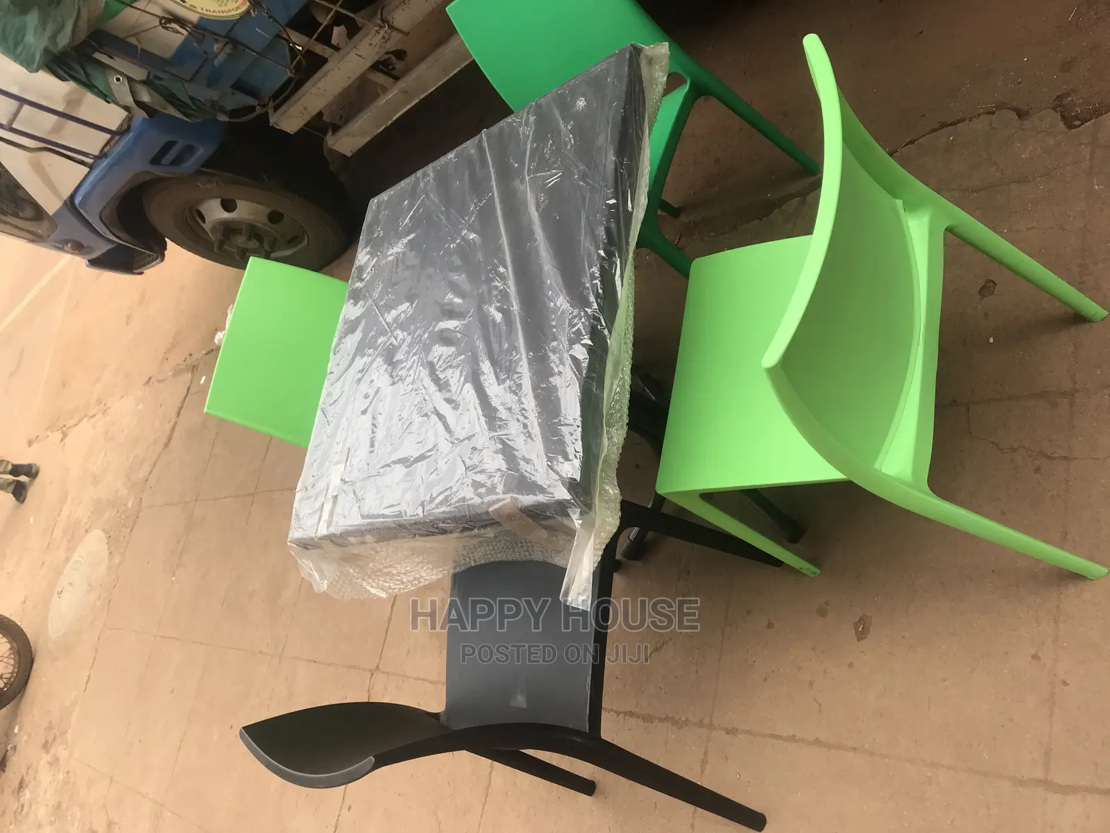 A Set of Strong Imported Table and 4 Plastic Chairs