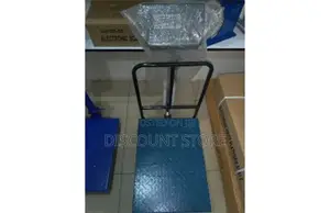 Checquered Plate Platform Weighing Scales With a Barrier.