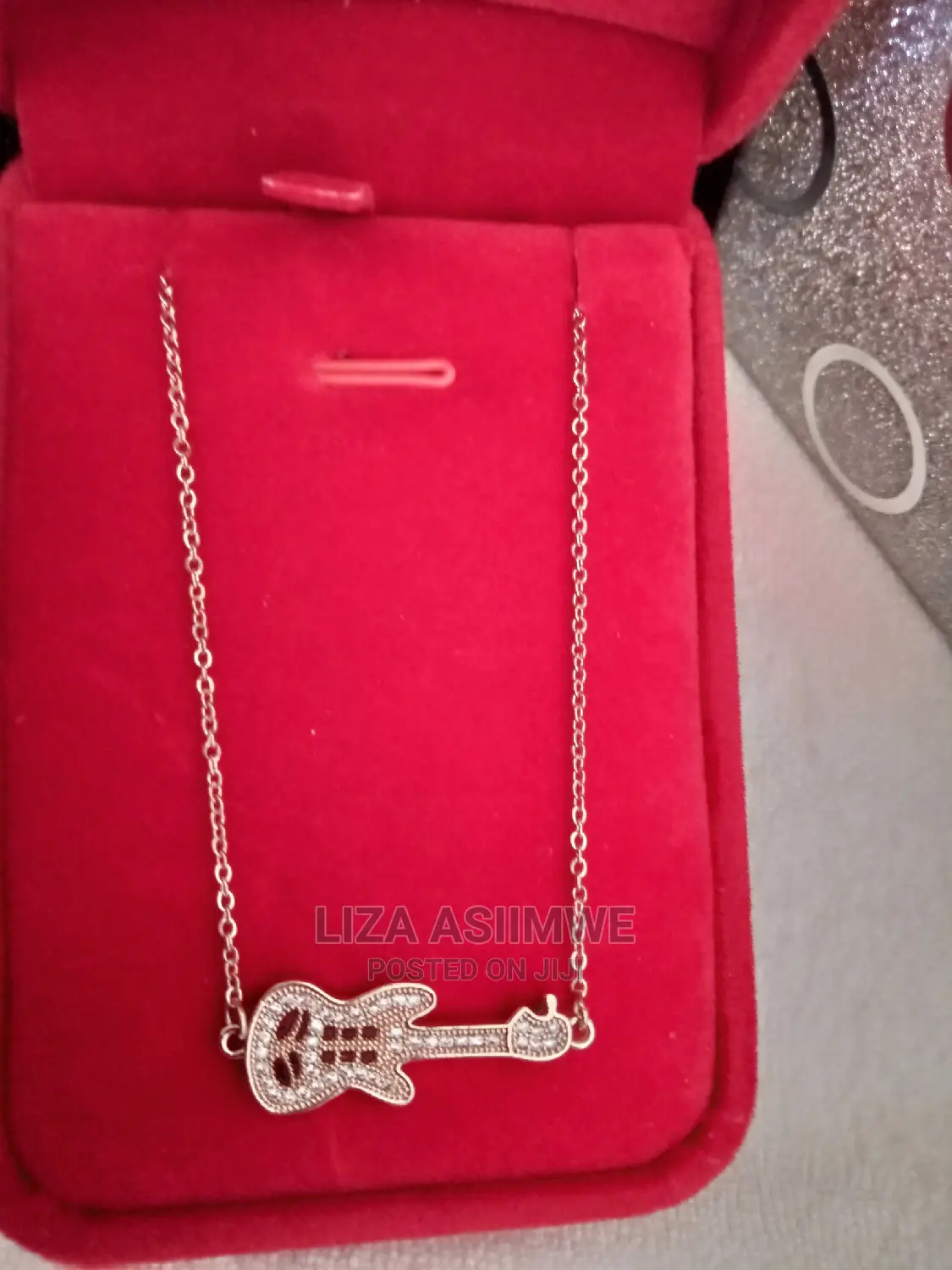 Unique Necklace With a Guitar Pendant Available With the Box