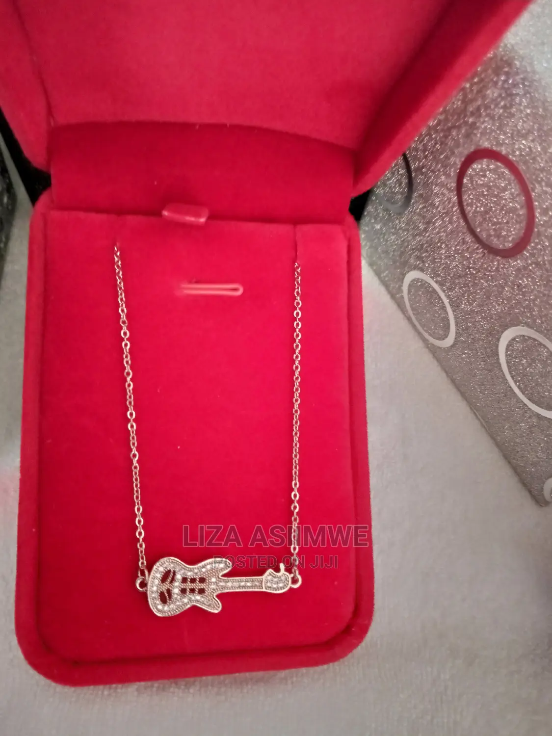 Unique Necklace With a Guitar Pendant Available With the Box