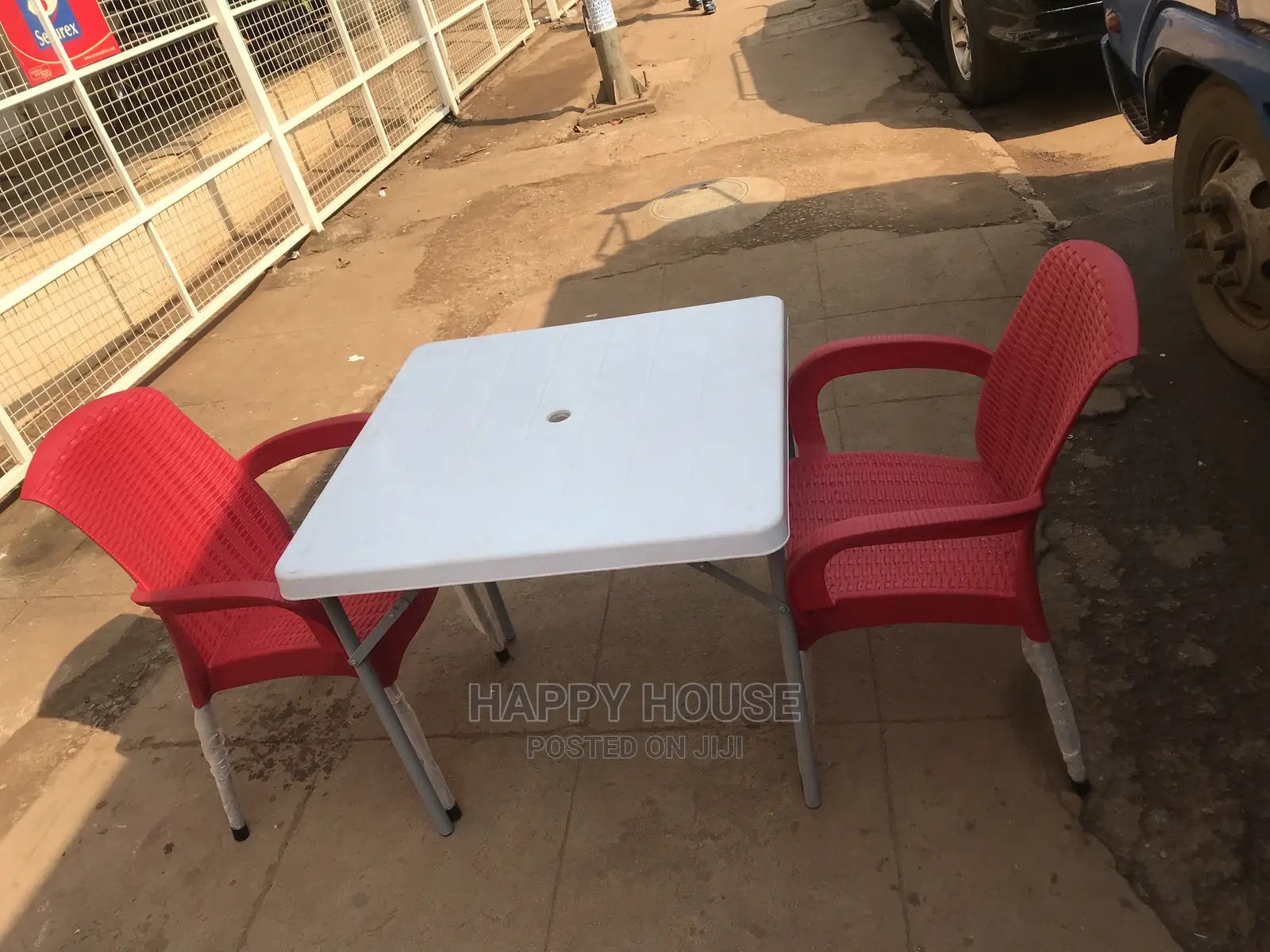 Set of Table and Two Plastic Chairs